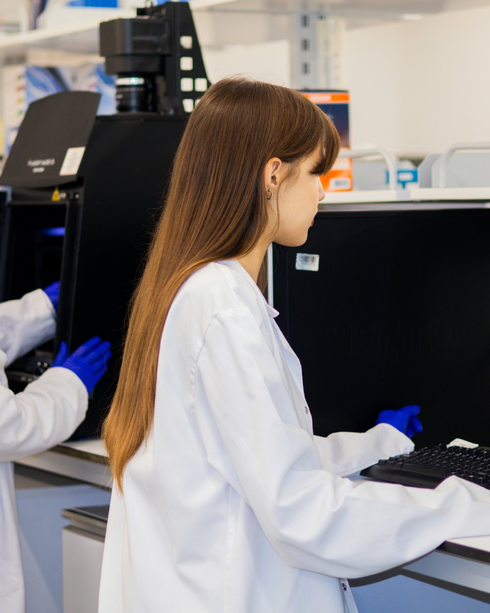 Researchers working with laboratory instruments